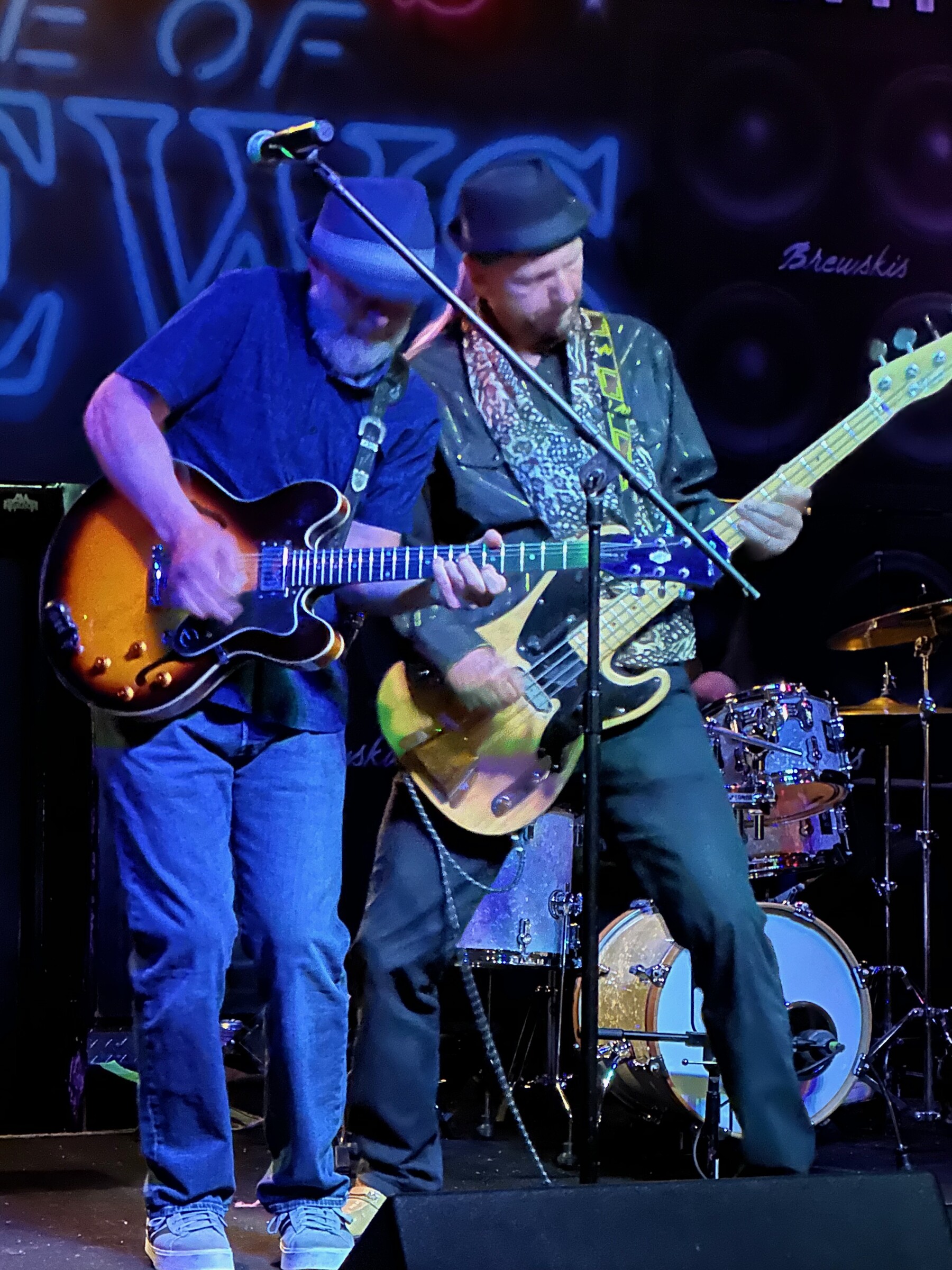 Junior and Fab leaning into a song together during a Basement Blues Revue performance